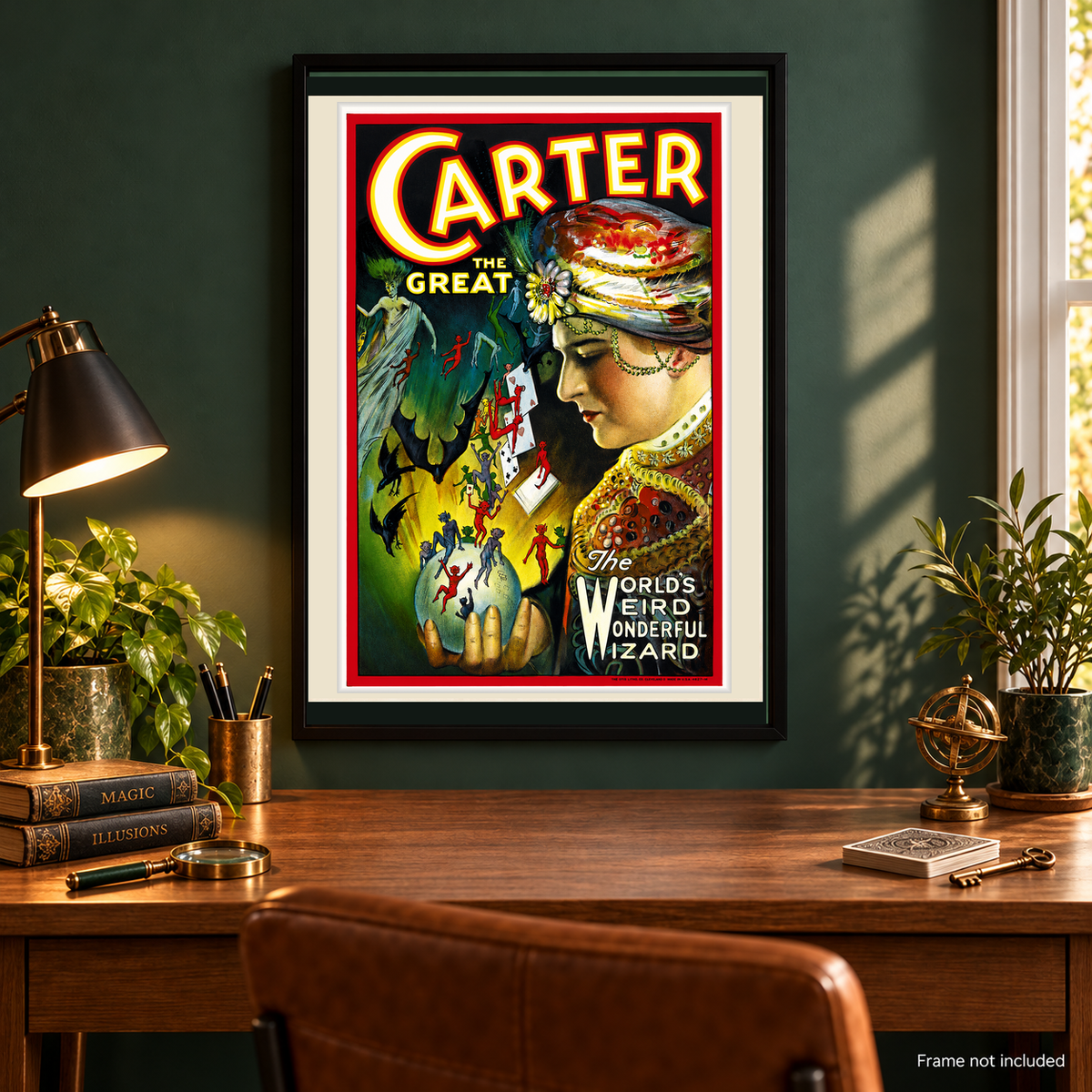 Framed Carter the Great World's Weird Wonderful Wizard poster above classic wood desk with magic books, playing cards and brass decorations; frame not included